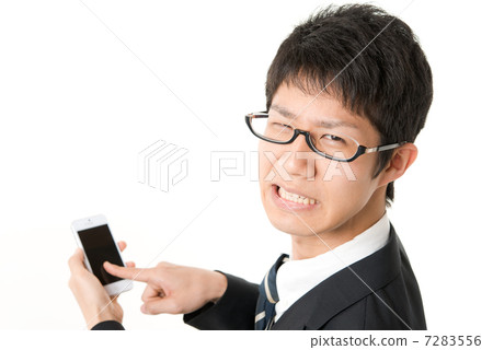 A man operating a smartphone A man operating a smartphone 7283556
