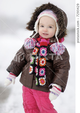 Adorable toddler girl having fun at winter 7293429