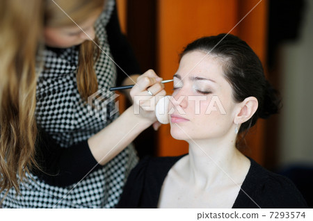 Young beautiful woman applying wedding make-up Young beautiful woman applying wedding make-up 7293574