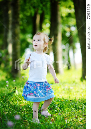 Adorable little girl portrait outdoors 7293829