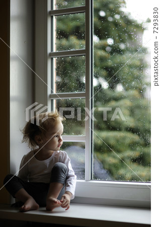 Adorable toddler girl looking at raindrops Adorable toddler girl looking at raindrops 7293830