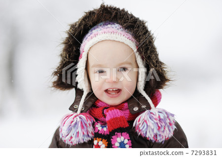 Little winter baby girl smiling 7293831
