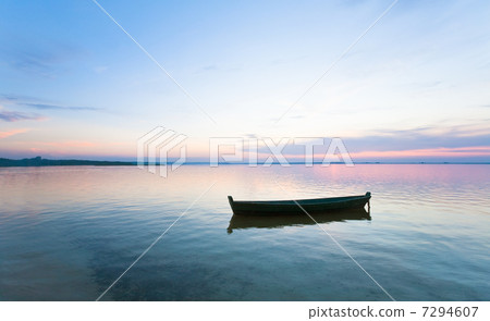sunset and boat on summer lake bank 7294607