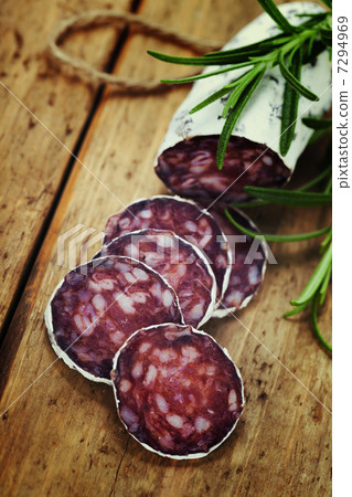 traditional sliced meat sausage salami on wooden board 7294969