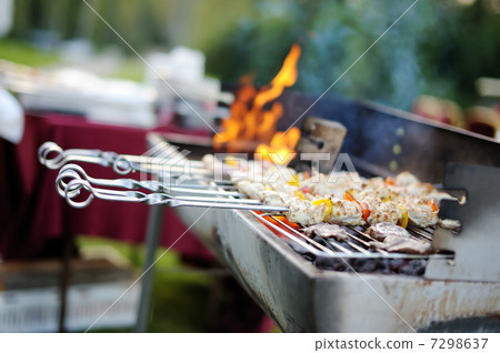 Kabobs grilled with vegetables on metal skewers 7298637