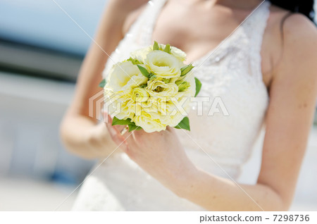 Bride holding beautiful wedding bouquet Bride holding beautiful wedding bouquet 7298736