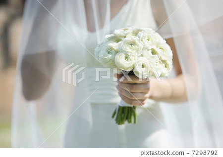 Bride holding beautiful wedding flowers bouquet 7298792