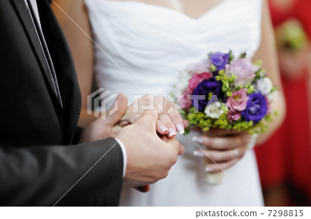 Groom holding brides hand Groom holding brides hand 7298815