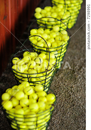 Baskets of golf balls on a golf field 7298991