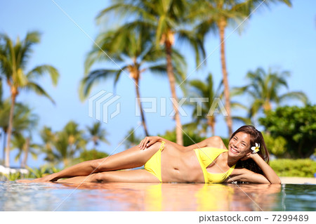 Spa resort woman enjoying a tropical vacation 7299489