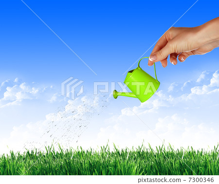 Hand with a small watering Hand with a small watering 7300346
