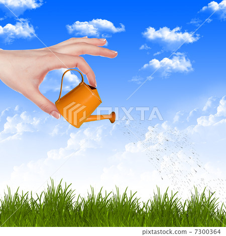 Hand with a small watering 7300364