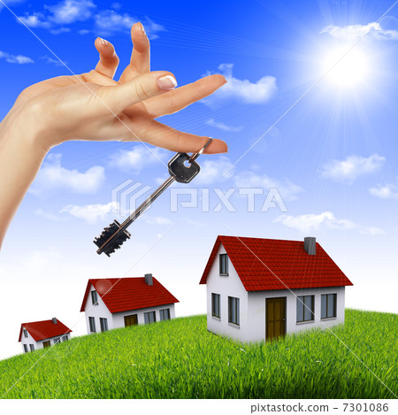 House in the hands against the blue sky 7301086