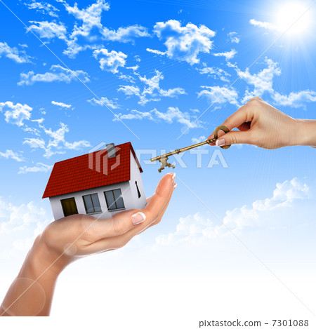House in the hands against the blue sky House in the hands against the blue sky 7301088