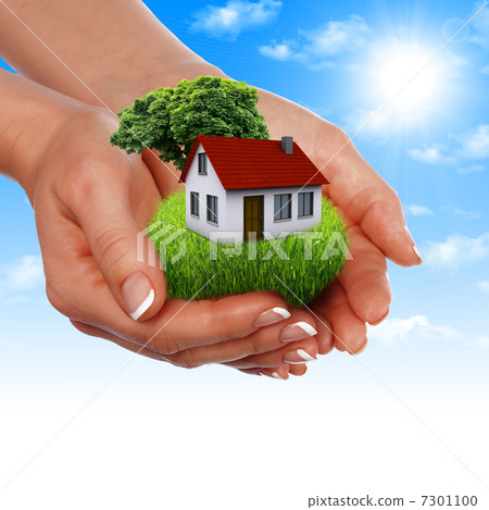 House in the hands against the blue sky 7301100