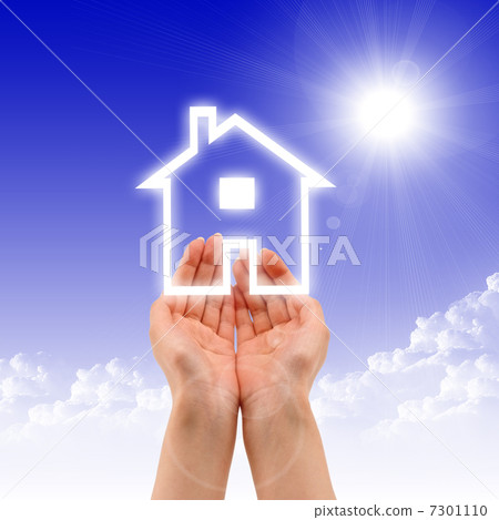 House in the hands against the blue sky 7301110