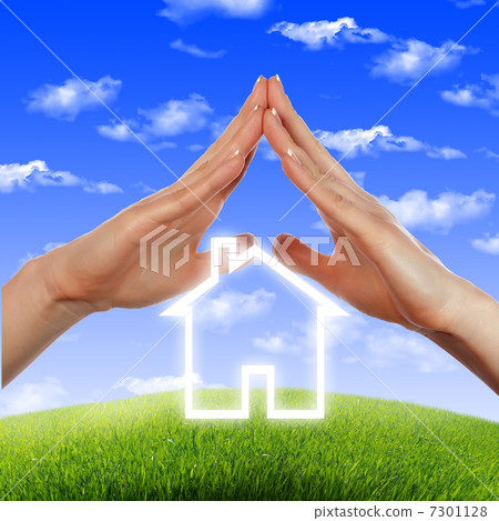 House in the hands against the blue sky 7301128