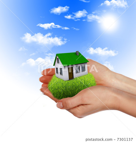 House in the hands against the blue sky 7301137