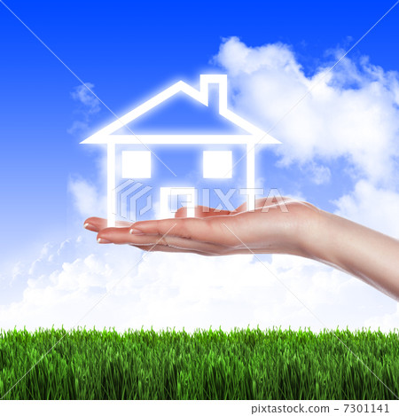 House in the hands against the blue sky 7301141