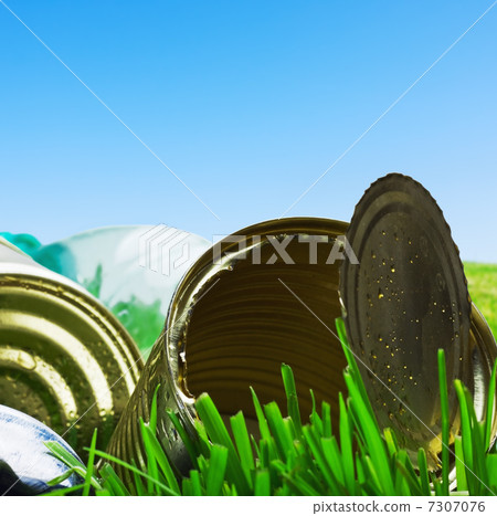 Old empty cans on the grass 7307076