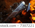 Light inside the limestone cave Vietnam · Halong Bay 7307221
