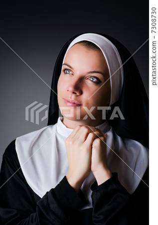 Young nun in religious concept Young nun in religious concept 7308730