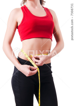 Young girl with centimeter in dieting concept Young girl with centimeter in dieting concept 7308731