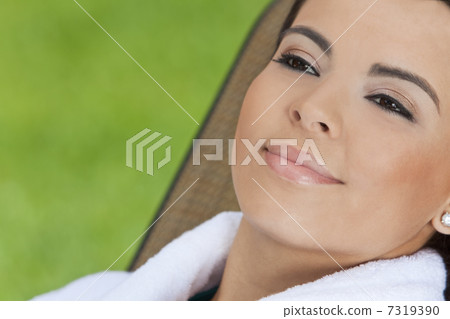 Beautiful Hispanic Woman in White Bathrobe At Health Spa Beautiful Hispanic Woman in White Bathrobe At Health Spa 7319390