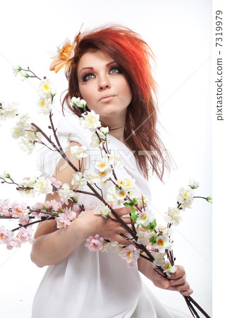 Portrait of beautiful woman with spring flowers on white Portrait of beautiful woman with spring flowers on white 7319979