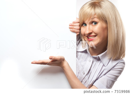 Attractive smiling woman holding white empty paper isolated on w Attractive smiling woman holding white empty paper isolated on w 7319986