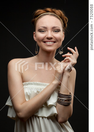 portrait of smiling beautiful young woman on black portrait of smiling beautiful young woman on black 7320088