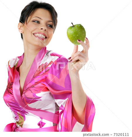 young beautiful happy woman holding green apple on white young beautiful happy woman holding green apple on white 7320111