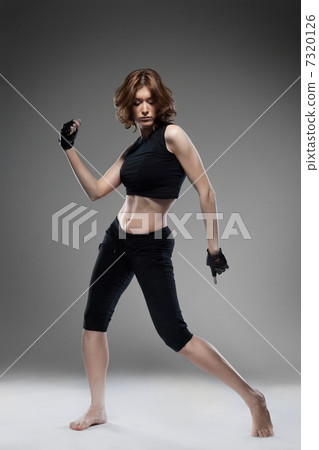 attractive young woman dancing 7320126