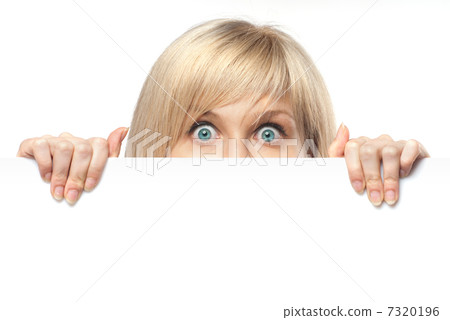 surprised young woman holding white empty paper isolated on whit surprised young woman holding white empty paper isolated on whit 7320196