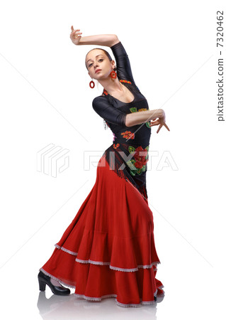 young woman dancing flamenco with castanets - Stock Photo