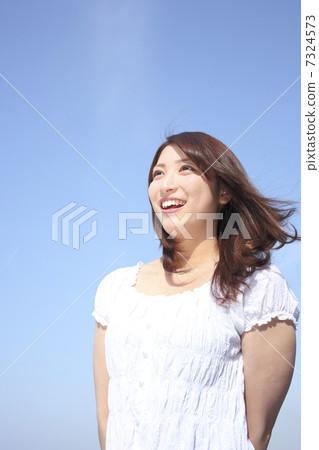A blue sky and a young lady 7324573