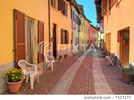 Narrow cobbled street among colorful houses in Italy. Narrow cobbled street among colorful houses in Italy. 7327272