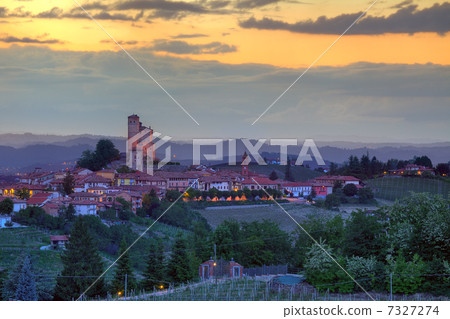 Small town on the hills at sunset in Italy. Small town on the hills at sunset in Italy. 7327274