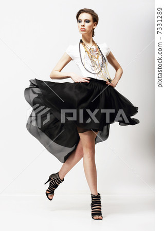 Motion. Vitality. Luxurious Supermodel in Fluttering Fashion Dress. Oscillation 7331289