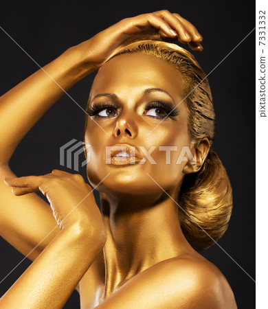 Reflexion. Portrait of Glossy Woman with Bright Golden Makeup. Bronze Bodypaint Reflexion. Portrait of Glossy Woman with Bright Golden Makeup. Bronze Bodypaint 7331332