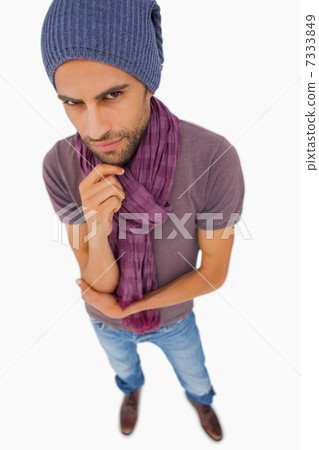 Thinking man wearing beanie hat and scarf Thinking man wearing beanie hat and scarf 7333849