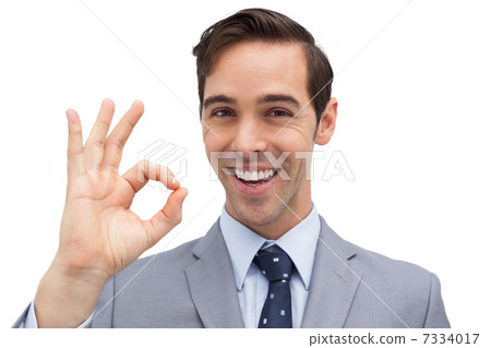 Successful businessman giving ok sign Successful businessman giving ok sign 7334017