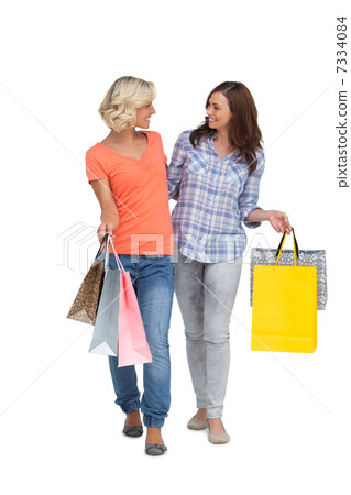 Two smiling friends with shopping bags 7334084