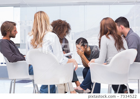 Therapist listening a woman crying 7334522