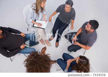 Patients listening to each other in group session 7334559