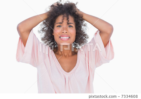 Stressed woman pulling her hair 7334608