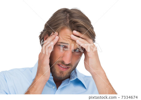 Tanned man having a strong headache Tanned man having a strong headache 7334674