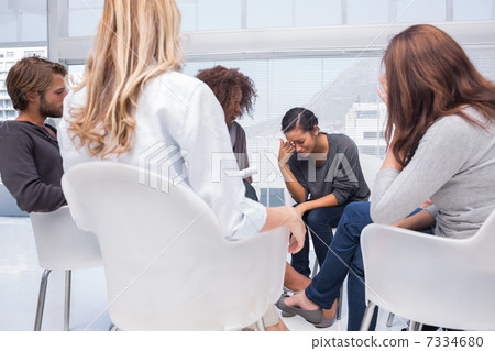Woman crying at group therapy 7334680