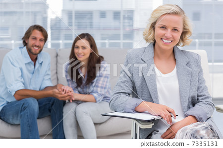 Smiling couple and therapist 7335131