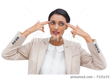Confident businesswoman pointing her head with her fingers Confident businesswoman pointing her head with her fingers 7335255